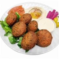 Falafel Platter · 6 pieces of falafel, hummus, lettuce, tomatoes and tahini sauce. Vegetarian.