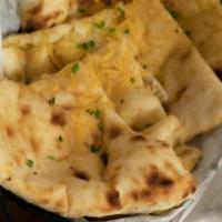 Cheese Naan · Oven baked flatbread.