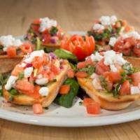 Bruschetta · Toasted garlic bread topped with tomato, extra virgin olive oil, red onion, basil, garlic an...