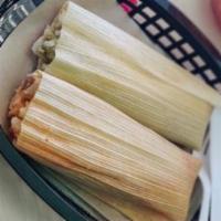 Green Tamale- Spicy · Hand-rolled in real corn husk, shredded chicken stuff with tomatillos, poblano peppers and j...