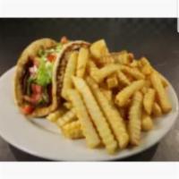 Gyro Sandwich and fries · Gyro meat, pita bread, lettuce, tomatoes, onion and tzatziki sauce.