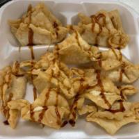 Crab Rangoons · Fried wonton wrapper filled with crab and cream cheese. 