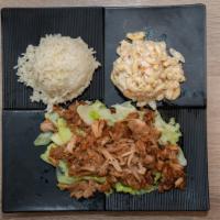 Kalua Pork with Cabbage · Smoke-flavored slowly-roasted traditional Hawaiian style shredded pork with cabbage.