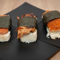 Spam Musubi · An island composed of a slice of grilled meat on rice,wrapped in dried seaweed.