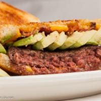 Sunset Burger · 1/2 lb. grass-fed beef, topped with melted cheddar cheese, crisp bacon, avocado, lettuce, sl...