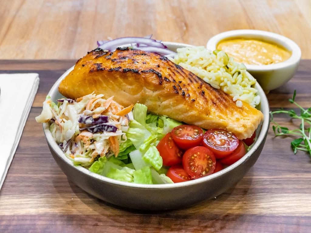 Salmon Bowl · A 7 oz. grilled salmon filet, lettuce, tomato, corn salsa, coleslaw, rice, and dressing.