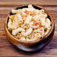 Lobster Mac and Cheese · Maine lobster meat, elbow macaroni, cheddar cheese, cream, and spices 