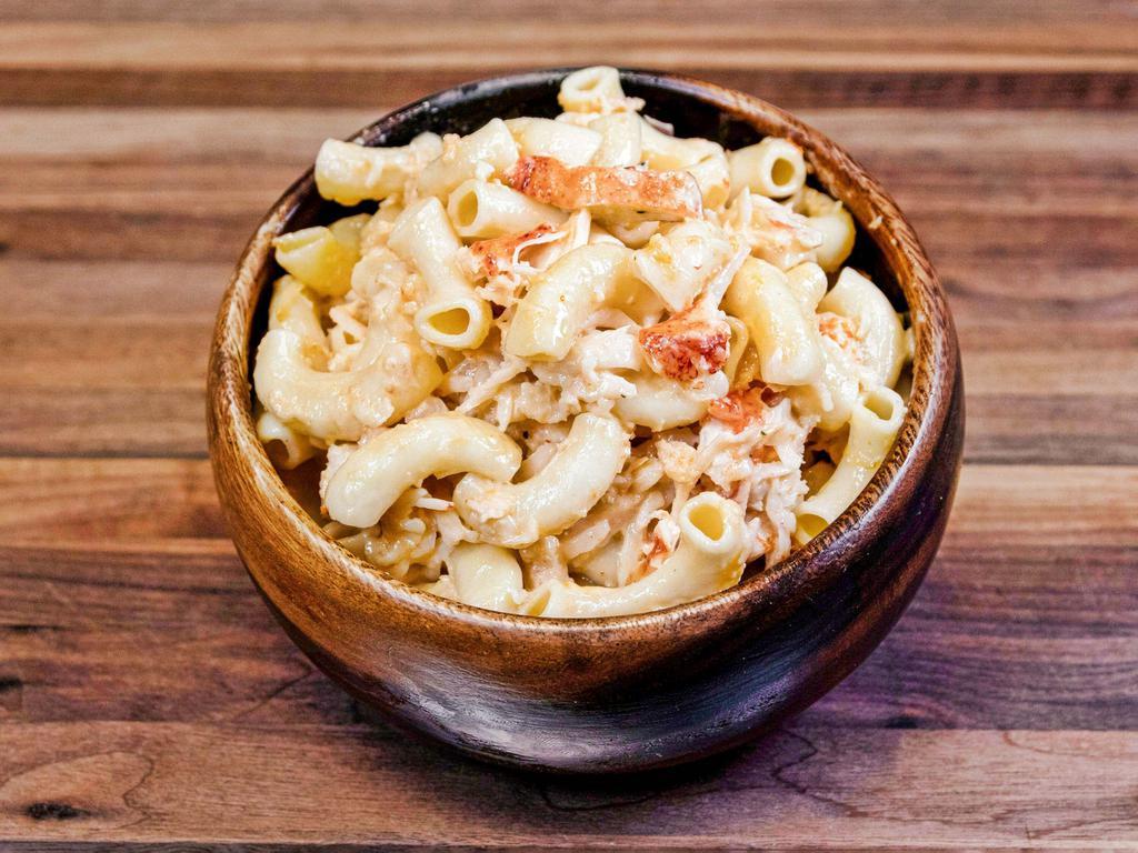 Lobster Mac and Cheese · Maine lobster meat, elbow macaroni, cheddar cheese, cream, and spices 