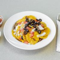 Supreme Nachos · With chili, cheese, seasoned ground beef, black olives, tomato, onion, salsa and sour cream.