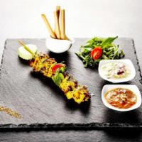 Chicken Satay · Savory chicken marinated in yellow curry powder and coconut milk. Served with our famous pea...