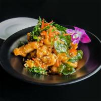 Crispy Garlic Chicken · Our house specialty. Lightly battered and fried boneless chicken pieces, stir-fried in a swe...