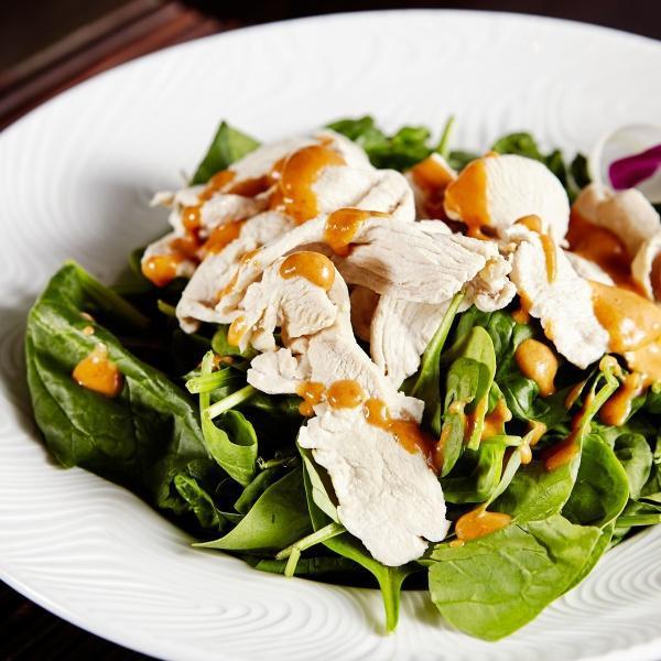 Swimming Rama · Sliced tender chicken breast served with fresh spinach drizzled with our famous homemade peanut sauce.