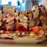 Banana Split Sundae · Choice of three yogurts, banana, hot fudge and choice of one topping with almonds and whippe...