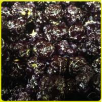 Blackberry Popcorn · Blackberry flavor, black color, candy-coated popcorn. Perfect for baby showers, birthday par...