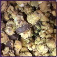Peanut Butter Chocolate Popcorn · Golden buttery caramel coated in white chocolate and creamy peanut butter, drizzled in choco...