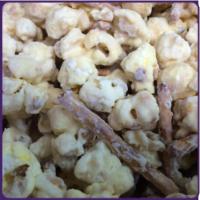 White Chocolate Pretzel Popcorn · Vanilla popcorn mixed with pretzels and coated in creamy white chocolate.