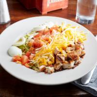 Cobb Salad · Grilled or fried chicken, mixed greens, cheddar jack, tomatoes, blue cheese crumbles, egg an...