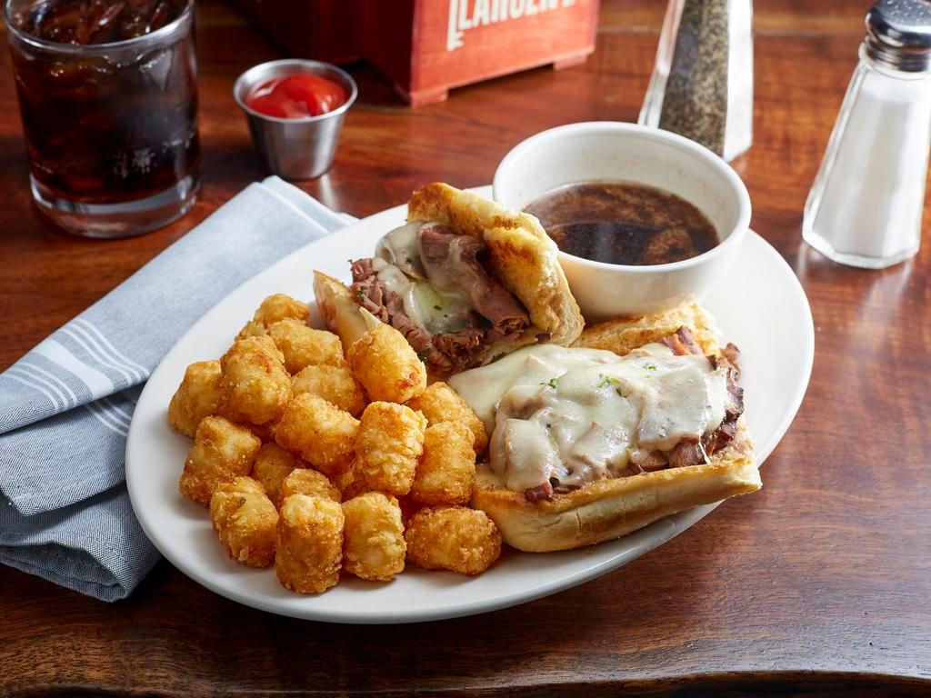 French Dip Sandwich · Shaved roast beef and provolone cheese served hot on a toasted hoagie roll with a side of au jus.