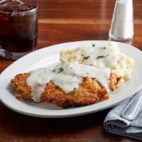 Country Fried Chicken · Hand-dipped chicken cutlet battered and fried smothered with white pepper gravy. Served with...