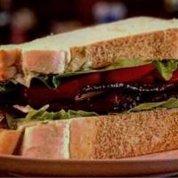 Marketplace BLT Sandwich · Bourbon smoked pepper bacon, mayo, heirloom tomato and groganica greens.