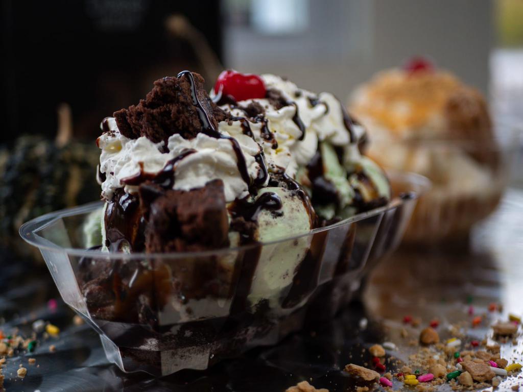 Brownie Delight Sundae · Brownie foundation, mint oreo or brownie chip ice cream, oreo cookie crumbles with chocolate drizzle.