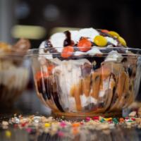 Reese's Delight Sundae · Peanut butter chip swirl ice cream, crushed reese's peanut butter cups with chocolate drizzl...