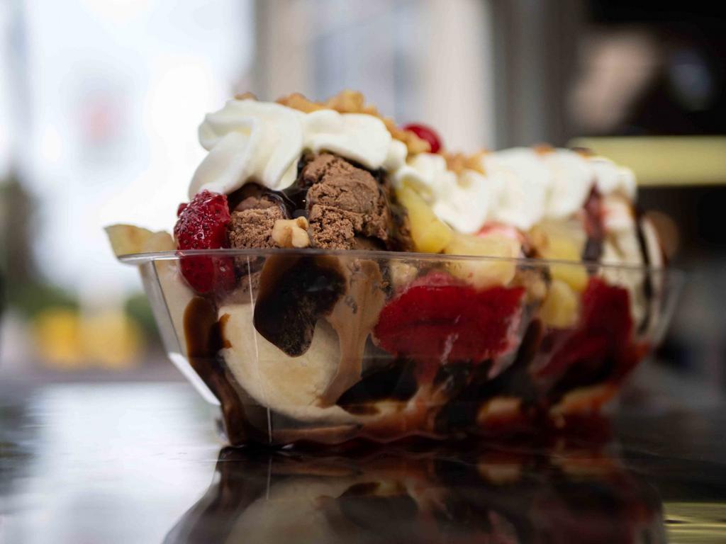 Banana Split · Sure to satisfy any sweet tooth!  Your choice of our super premium ice cream nestled on a split of banana with hot fudge, walnuts, strawberries, pineapple and topped with whipped cream and a cherry.

*** Our Products May Contain Nuts ***