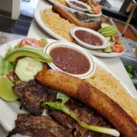 Montanero Plate · Colombian typical plate, grilled steak, pork rind, rice, beans, egg, fried sweet plantains a...