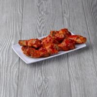 Buffalo Wings · Ten baked wings smothered in our special buffalo sauce. Served with ranch dressing.