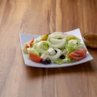 Greek Salad · Iceberg lettuce, feta, tomatoes, cucumbers, onions, and pepperoncini with homemade zesty vin...