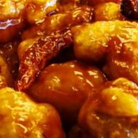 S1. General Tso's Chicken · Lightly breaded chicken served with spicy and sweet general tso's sauce. Served with white r...