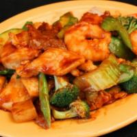 S8. Triple Delight · Jumbo shrimp, chicken, beef with variety of vegetable in delicious brown sauce. Served with ...