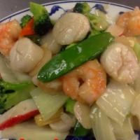 S16. Seafood Delight · An elegant combination of jumbo shrimp, scallop, squid, crab meat sauteed with vegetable in ...