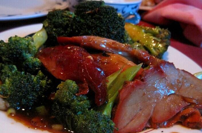 70. Roast Pork with Broccoli · Served with white rice.