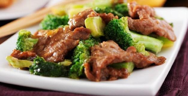 76. Beef with Broccoli · Served with white rice.