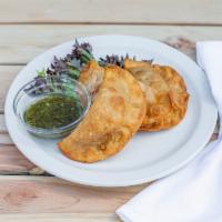 Beef Empanadas · It comes with chimichurri sauce.