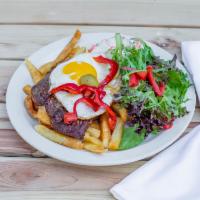Chivito Sandwich · Steak, ham, cheese, egg, rusa salad, spring salad, fries, peppers, and olives.