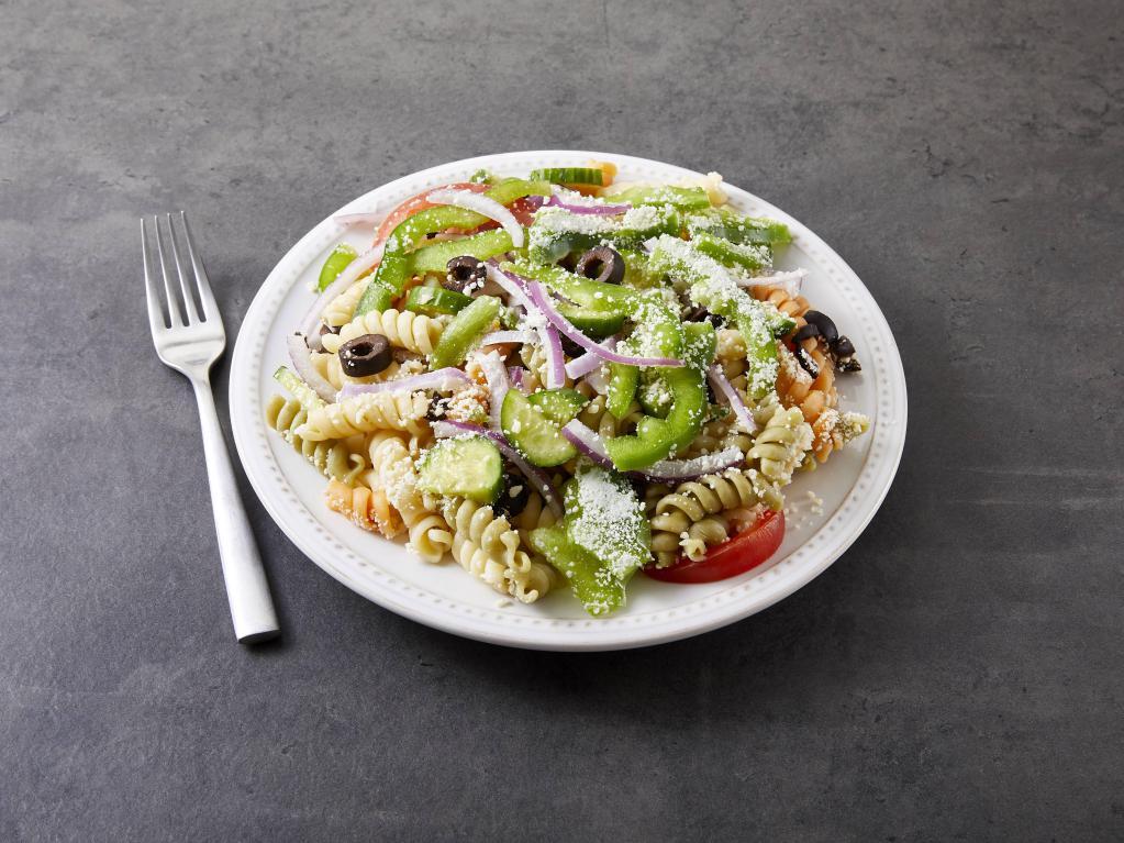 Pasta Salad · Tri-colored pasta, green peppers, red onions, tomatoes, cucumbers, black olives, Parmesan cheese and Italian dressing.