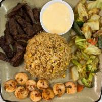 Churrasco and Shrimp Combination · Grilled meat and shell fish.