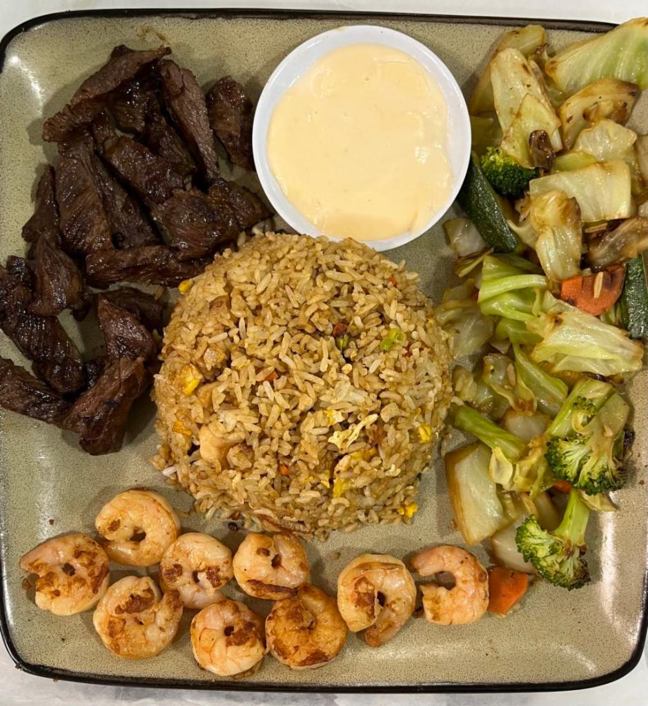 Churrasco and Shrimp Combination · Grilled meat and shell fish.