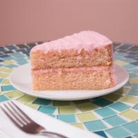 Strawberry Cake · Strawberry flavored cake, bursting with fresh strawberries inside and out, frosted with stra...