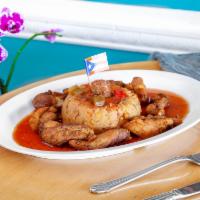 Mofongo de Chicharron de Pollo · Fried plantains, seasoned and mashed together to form a mountain of deliciousness! Topped wi...