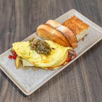 Woke Omelet · Steak, roasted red peppers, caramelized onions, house chimichurri and gouda, with toast and ...