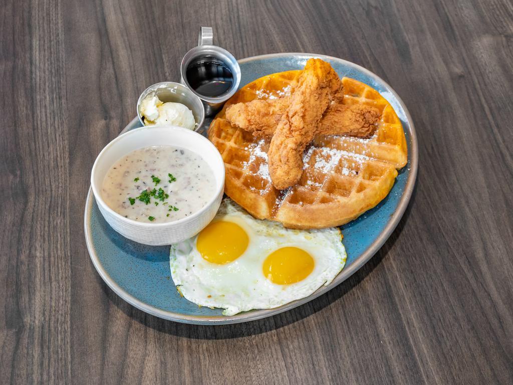 Chicken and Waffle · Belgian waffle, crispy chicken strips, 2 eggs cooked to order and pork sausage gravy. limited supply.