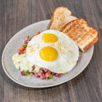 Corned Beef Hash · Corned beef, onions, peppers, hash browns, choice of eggs and toast. Topped with hollandaise.