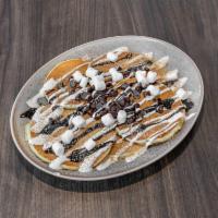 S'mores Pancakes Combo · Combo it add 2 eggs cooked to order and choice of breakfast meat.