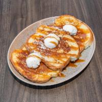 Farnam French Toast · 3 slices of French toast, grilled golden brown, topped with whipped mascarpone and caramel d...