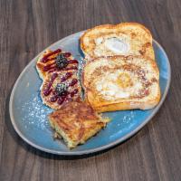 The Bird Cage · 2 slices classic French toast with 2 fried eggs in the middle and a side hash browns. Sorry,...