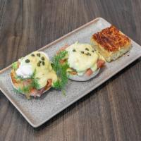 Smoked Salmon Benny · Cold smoked salmon, avocado, capers, poached eggs, with hollandaise and fresh dill.