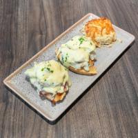 Waffle Cordon Bleu Benny · Grilled chicken, smoked ham, Swiss cheese, poached eggs and hollandaise over mini waffles.
